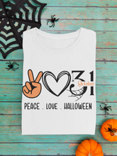 Load image into Gallery viewer, White t-shrit  saying peae. love. halloween below emjoi symbls 